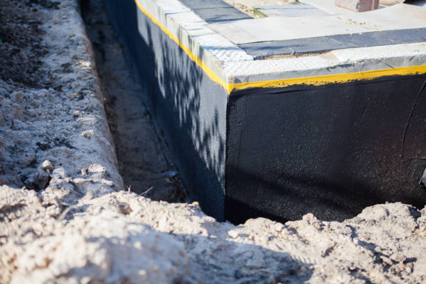 Professional Basement Waterproofing technician working in Barnesville, GA